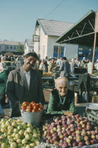 Elderly stallholders selling fruit at market.Kyrgyzstan Kirghizstan