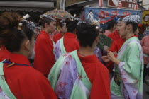 Women aged 20-30 years old in traditional Edo-era costumes get instructions before pulling their neighborhood dashi or wagon during the Gion MatsuriFestival  Festival