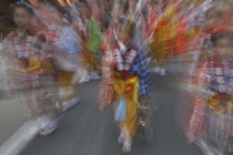 8 year old Maki Tsuchiya leads her neighborhood tekomae  girls that walk before the Dashi or wagon during Gion Matsuri wearing traditional Edo-era costume Radial Blur. Festival  Festival