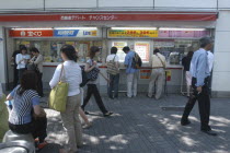 Ginza. People buying tickets at a kiosk for a popular high stakes lottery