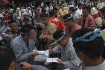 Gion Matsuri. Men in Edo-era costumes  each specific to their neighborhood  exchange gifts before starting that days festivities