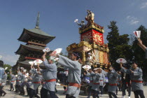 Gion Matsuri. Members dance in front of Narita san Temple before pulling neighborhood dashi or wagon through the streets