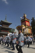 Gion Matsuri. Members dance in front of Narita san Temple before pulling neighborhood dashi or wagon through the streets