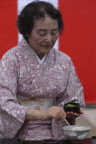 Licensed tea master Shikako Namba prepares green tea "macha" at a tea ceremonysenior citizen Asia Asian Japanese Nihon Nippon Old Senior Aged One individual Solo Lone Solitary