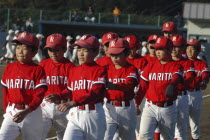 A little league team from Narita parades as part of a tournament opening ceremony8-12 years old  3rd to 6th grades