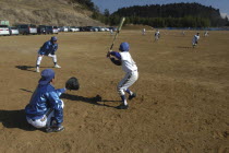 Coach Ishii checks batting form of 11 year old 5th grader  Yuki Katsumata  member of Toujou Shonen Yakyu baseball Club