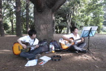 Yoyogi Park. Yuki Nakagawa and Yousuke Koyama  both 15 years old  meet here on Saturday afternoons to practice guitars and sing Harajuku