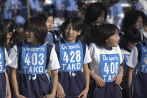 11-12 year old girls await the start of 2 kilometer race which is part of the towns fitness festival5th and 6th grade