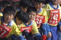 10-11 year old boys  who are members of local soccer club  wait the start of 2 kilometer race which is part of the towns fitness festival4th and 5th grade