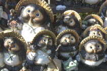 Mashikoi. Ceramic tanuki or racoon dog  traditional welcoming symbol placed at the homes door