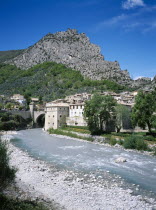 Entrevaux. View along the river Var toward the medieval village and rocky cliff above
