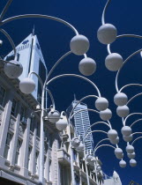 Angled view looking upwards through street lamps on Hay Street