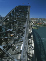 Sydney Harbour Bridge seen from Pylon Lookout with people on Bridge Climb below