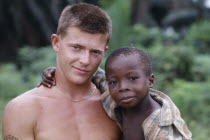 British soldier holding Korup boy.