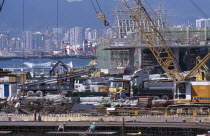 View over building site working on underground tail link to new airport from Central Hong Kong.