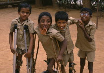 Group of boys on crutches playing and laughing at The Institute for The Disabled.