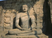 Gal Vihara.  Mid twelth century seated Buddha figure carved from granite.11th -13th Century capital