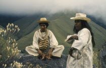 Ramonil and Juancho two Kogi priests from the Sierra de Santa Marta against a backdrop of misty green hillsNamed Ramonil and Juancho