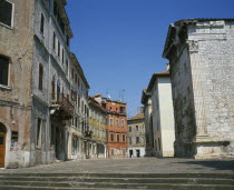 Street on the site which was once the Roman Forum at the back of the Temple of Romae and AugustusPola