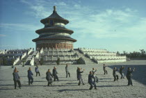 Men doing Tai Chi in front of the Hall of Prayer for Good Harvests at the Temple Of Heaven complexPeking Beijing