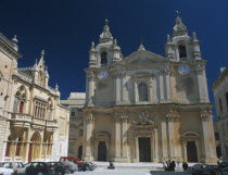 St Paul s Square and Mdina Cathedral. View of exterior with cars parked in front.