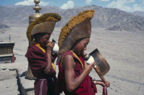 Monks at the monastery blowing horns