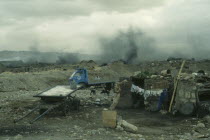 View over rubbish dump and dwellings.