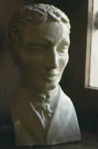 Close up of bust of Louis Braille lit by nearby window