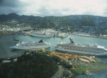 View over town and Port Castries with cruise ships from above.