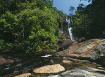 Telaga Tujuh Seven Wells Waterfall with the stream in the foreground