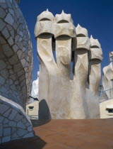 La Pedrera.  Gaudi architecture  carved chimney pots on the rooftop.