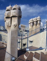La Pedrera.  Gaudi architecture  carved chimney pots on the rooftop.