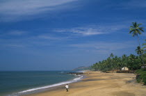 India, Goa, Anjuna, view along near deserted beach.