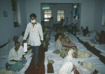 Cataract camp with man wearing surgical mask