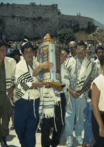 Bar Mitzvah at ethe Western Wall with the Torah being carried