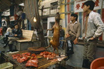 Dog meat for sale on street stall.