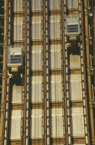 Lloyds Building lifts with passenger on building exterior.