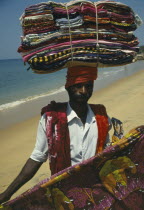 Fabric salesman on Kovalam Beach.