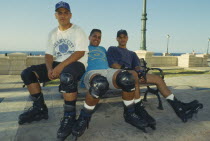 Three teenage boy rollerbladers.