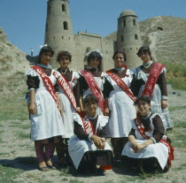 Girl students  traditional dress  graduation sashes