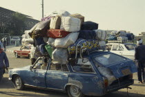 Sudanese family in overloaded car waiting for ferry to Sudan