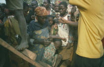 Mass transportation of Hutu refugees in overcrowded UN trucks.