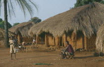 Typical roadside dwellings of the Sango Tribe with mud brick walls and thatched roof.
