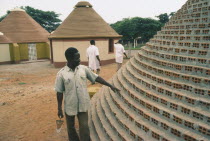 Builder working on new village housing.