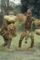 Bapende tribe animal masqueraders performing dance at initiation ceremony.