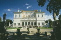 Vila Borghese.  Exterior facade and gardens with crowds of visitors.