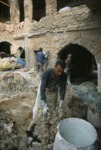 Chouwara Tanneries.  Stripping fleece from skins before dyeing.Fez