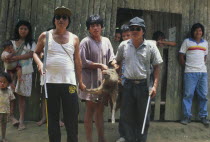 Machiguenga hunters with recently killed wild boar.