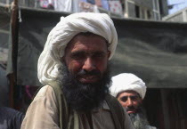 Afghan Tradesman with beard and white head-dress.