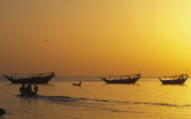 Traditional Omai fishing Dhows  returning to port  early morning.Middle East Omani Classic Classical Historical Older History Scenic